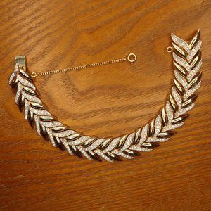 Crown Trifari signed vintage gold tone bracelet with rhinestones.
